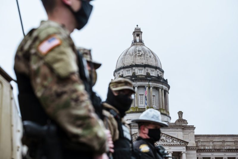 Small numbers of protesters gather at fortified US capitols