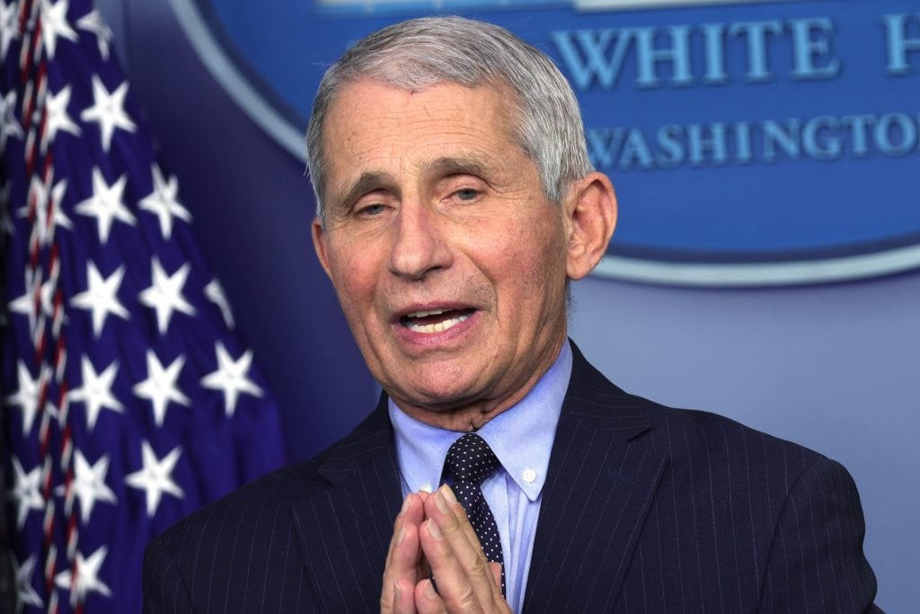 Fauci cautiously warns we could still be wearing masks in 2022