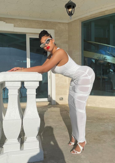 ‘Baddessttt in the Gameee’: Jordyn Woods Models Tight-Fitting White Dress, and Fans Are Obsessing Over Her Curvy Body