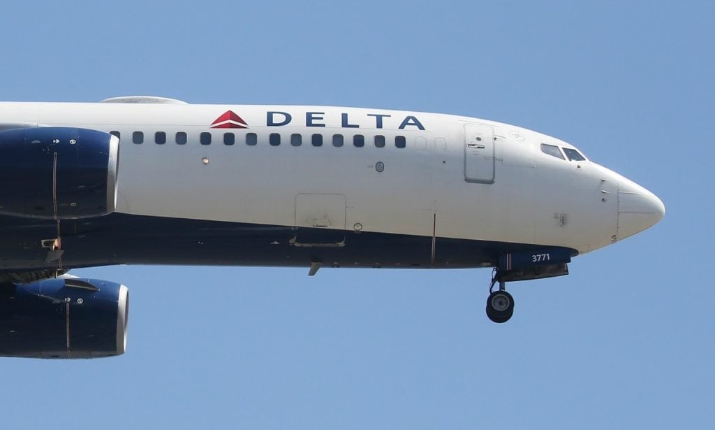 Delta passenger accused of trying to open cockpit, hitting flight attendant