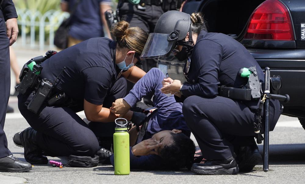 Man stabbed at LA anti-vaccination protest leaves hospital