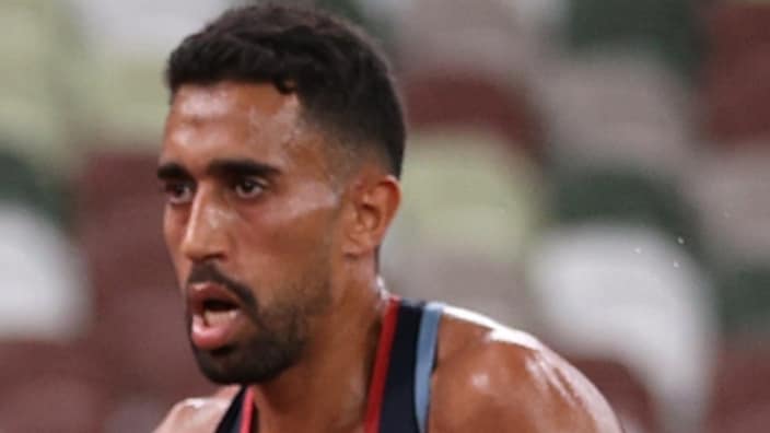 Olympic runner Amdouni knocking down water bottles during race causes debate