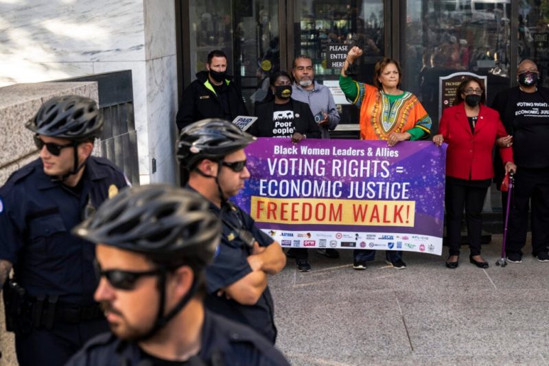 Voting rights protests return in Washington after Biden finally passes infrastructure law