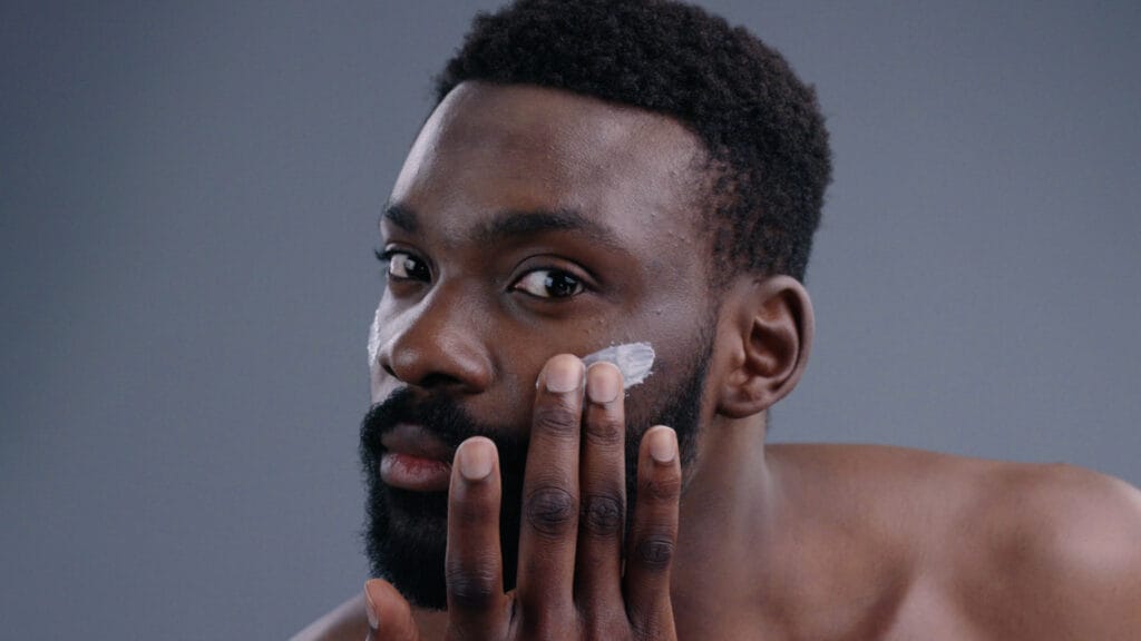 Black entrepreneur developing skin care line for dark skin men