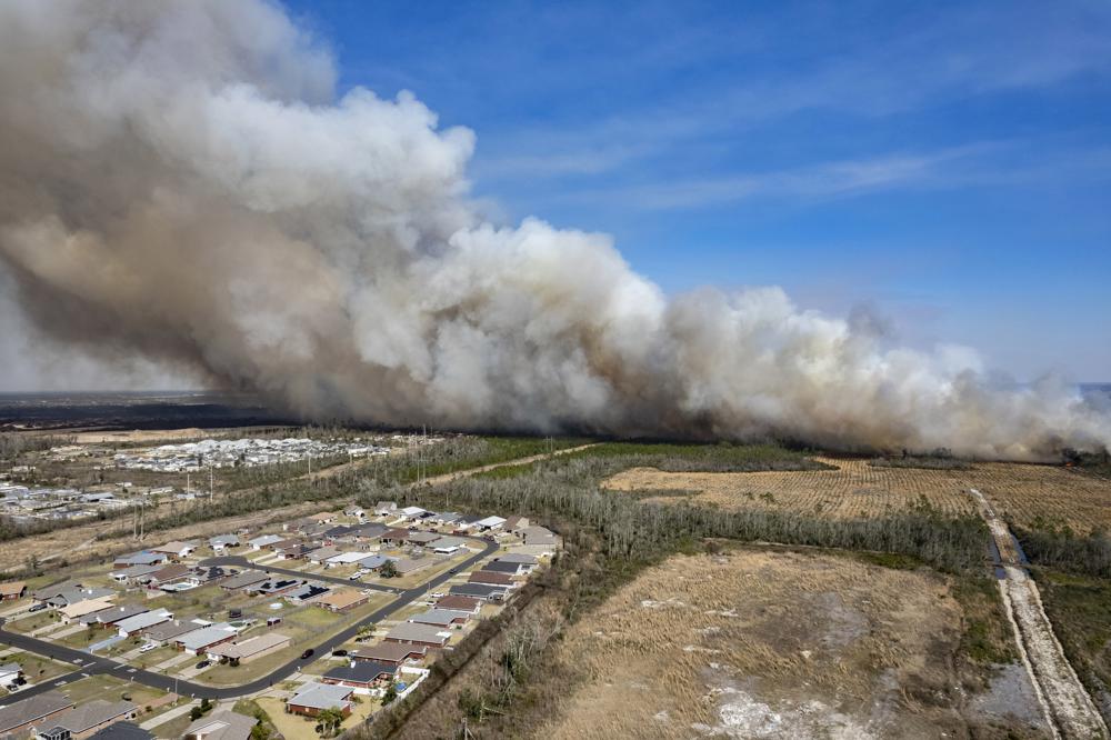 Firefighters battle 2 massive wildfires in Florida Panhandle