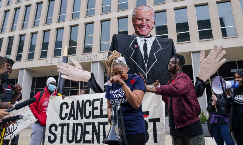 Biden Tells Loan Servicers To Hold Off As He Considers Action On Federal Student Debt