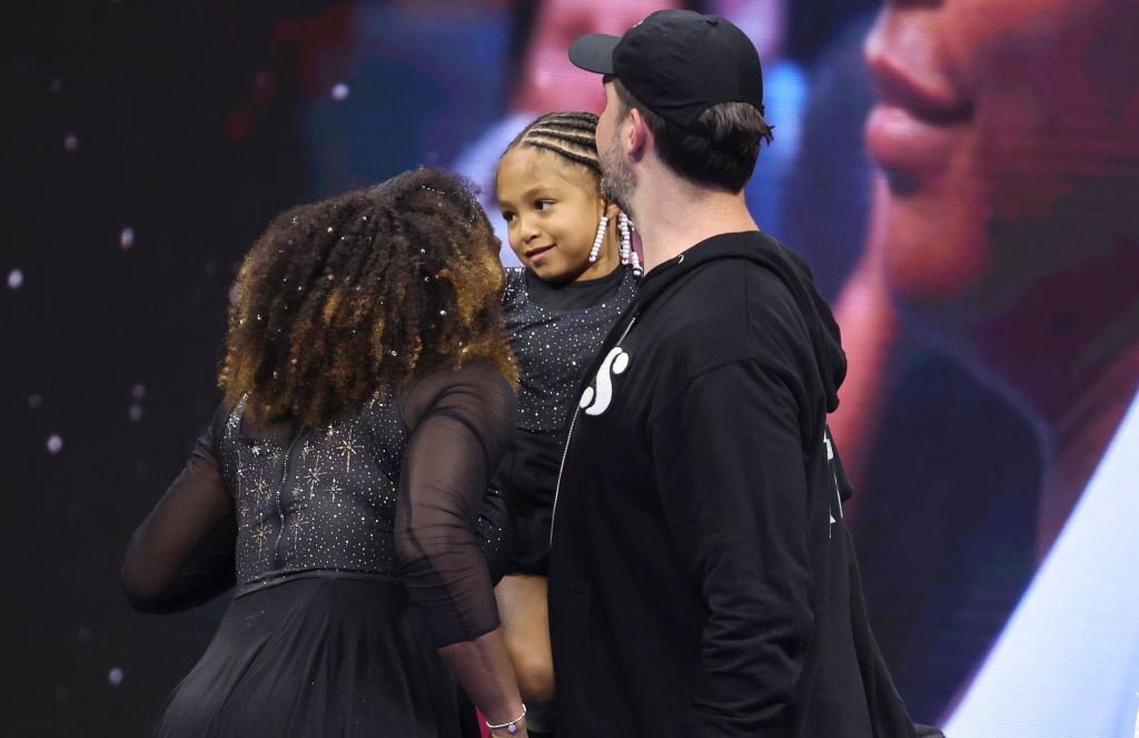 Serena Williams Shares Sweet Moment With Her Daugther Doing Hair And Reading “The Adventures Of Qai Qai”