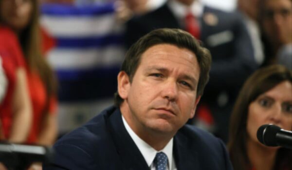 ‘These Deaths Are on Your Hands!’: Florida Gov. DeSantis Heckled at Vigil for Victims of Jacksonville Dollar General White Supremacist Shooter