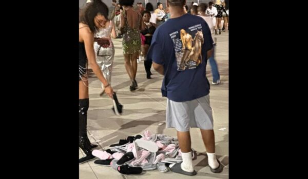 ‘The Hustle Is Real’: Viral Photo of ‘Flip-Flop Man’ Outside of Beyoncé Concert Has Many Calling Him a Genius  