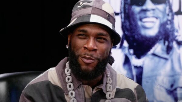 Burna Boy Name-Drops Malcolm X and Louis Farrakhan to Support His Controversial Remarks About Black Americans Not Knowing Their Roots