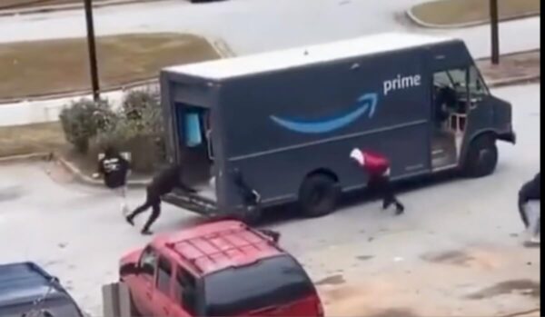 Helpless Amazon Driver Looks on as Group of Thieves Raid Delivery Truck In Broad Daylight, Viral Video Shows