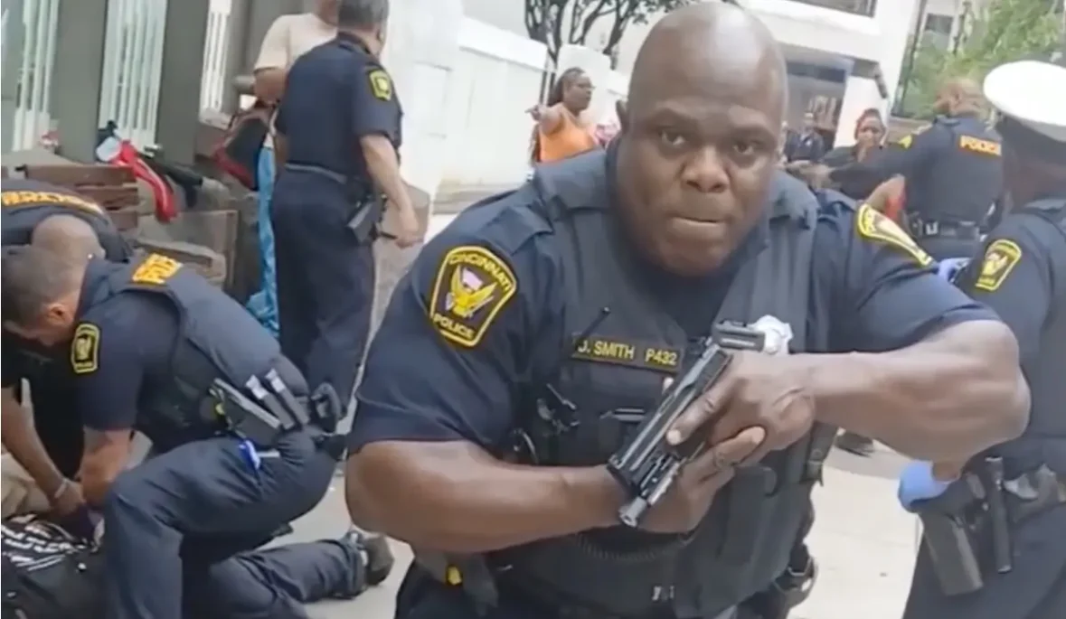 ‘You’re Going to Shoot Me or Something?’: Cincinnati Cop Pulls Gun On Black Man Filming His Friend’s Arrest, Blocking His View Before Charging Him with Obstruction