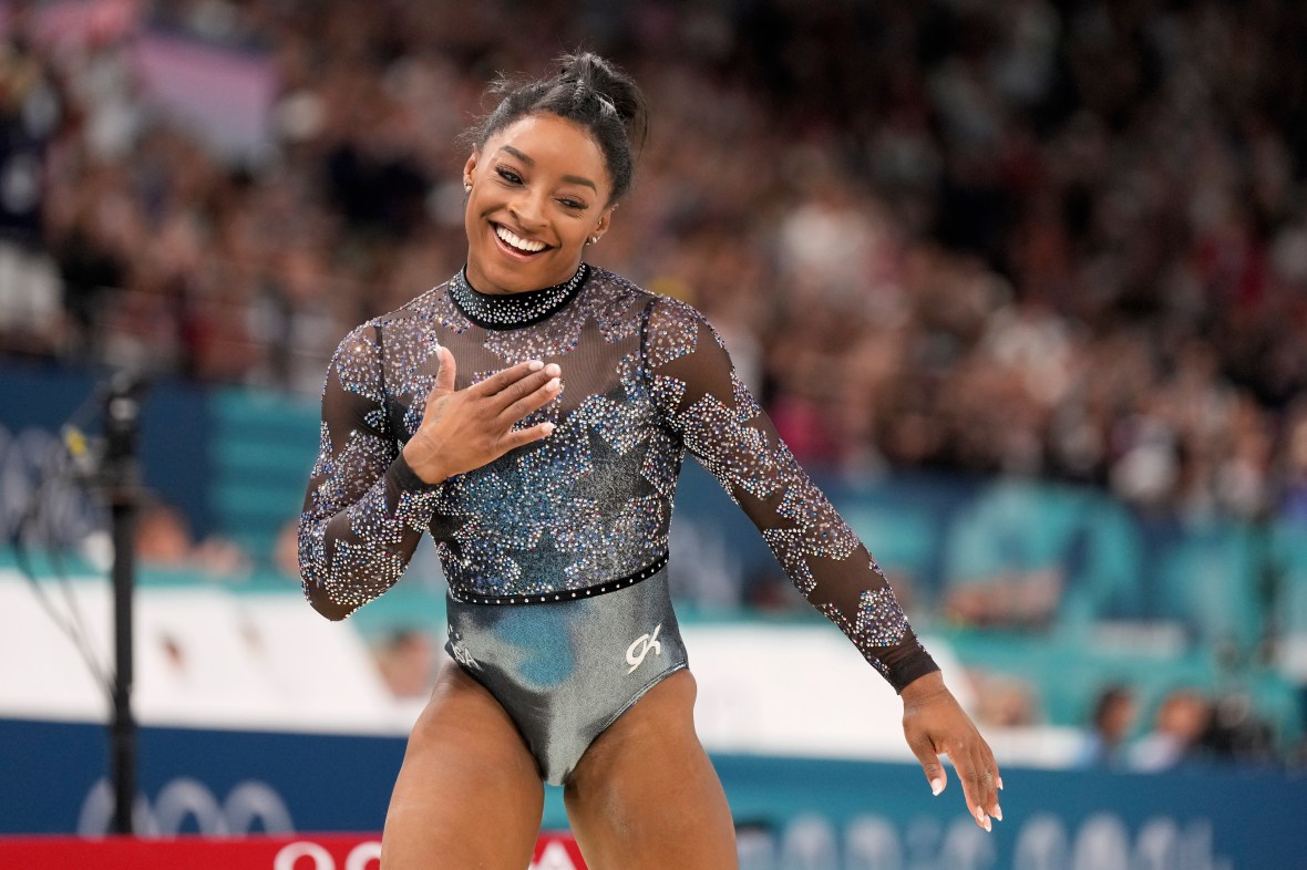 Simone Biles shakes off a calf injury to dominate during Olympic gymnastics qualifying