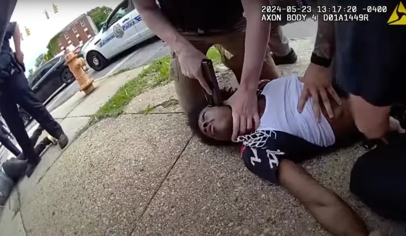 ‘I Ain’t Reaching for Nothing!’: Baltimore Cop Presses Gun to Black Man’s Head As He’s Restrained During Mistaken Identity Arrest Then Walks Free