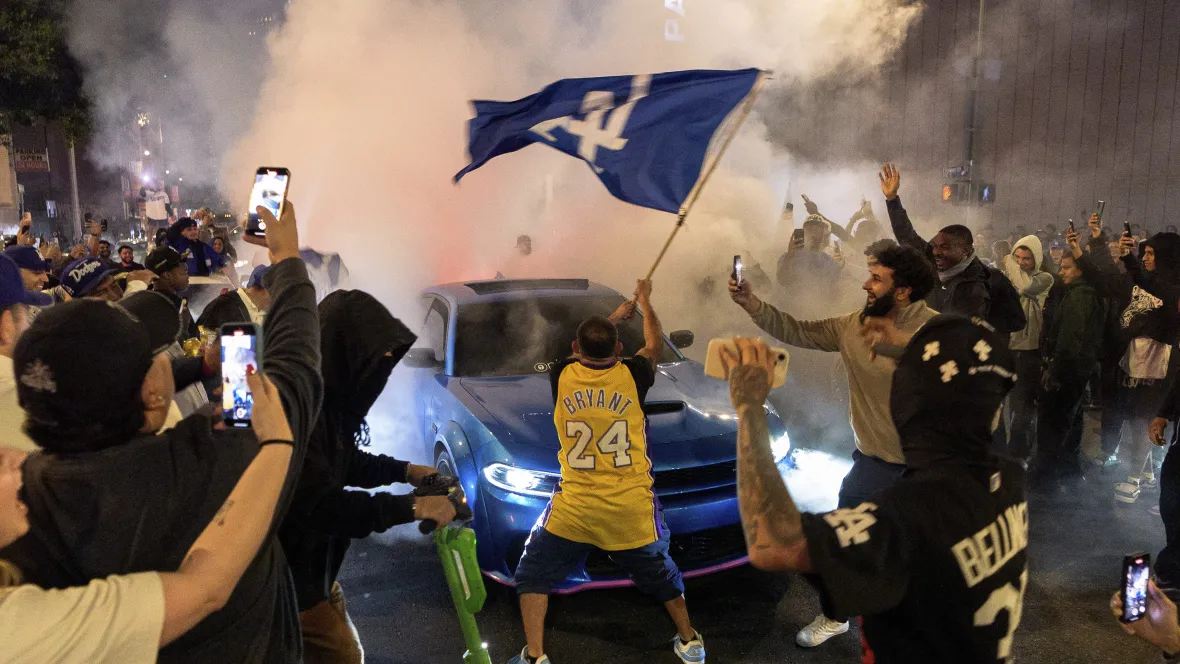 Los Angeles sees bus burned, store thefts and rowdy crowds after Dodgers win World Series