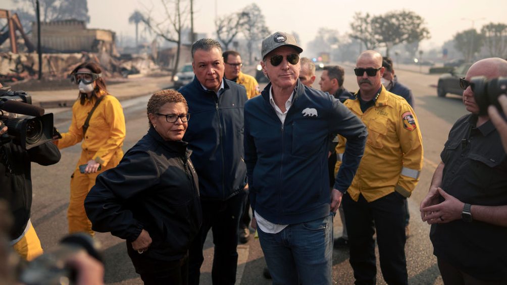 Ash and other dangers mean LA area residents who fled fires a week ago won’t be going home soon