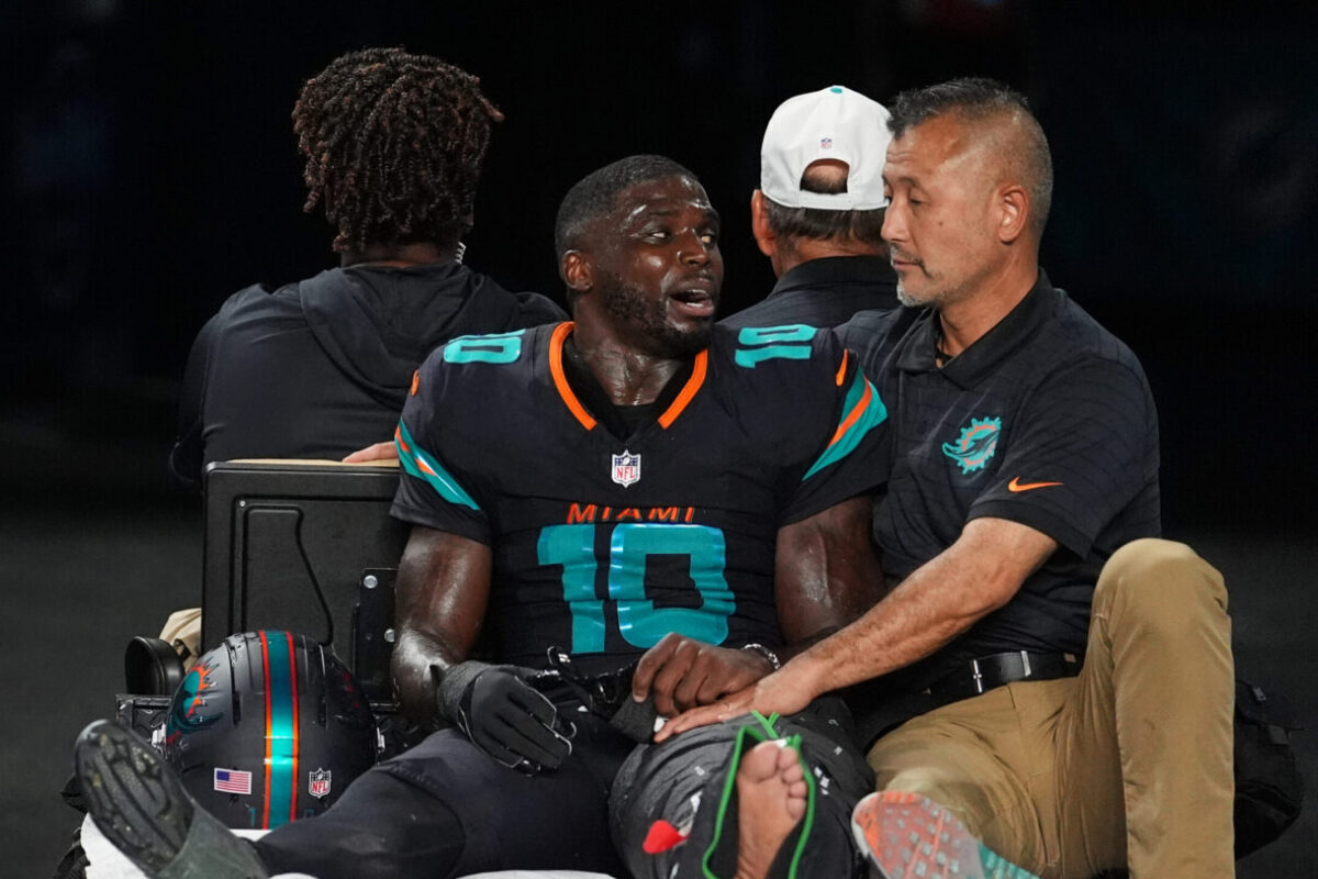 Dolphins’ Tyreek Hill carted off field and taken to hospital with dislocated left knee