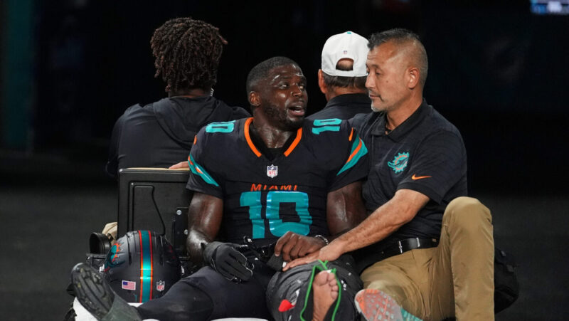 Dolphins’ Tyreek Hill carted off field and taken to hospital with dislocated left knee