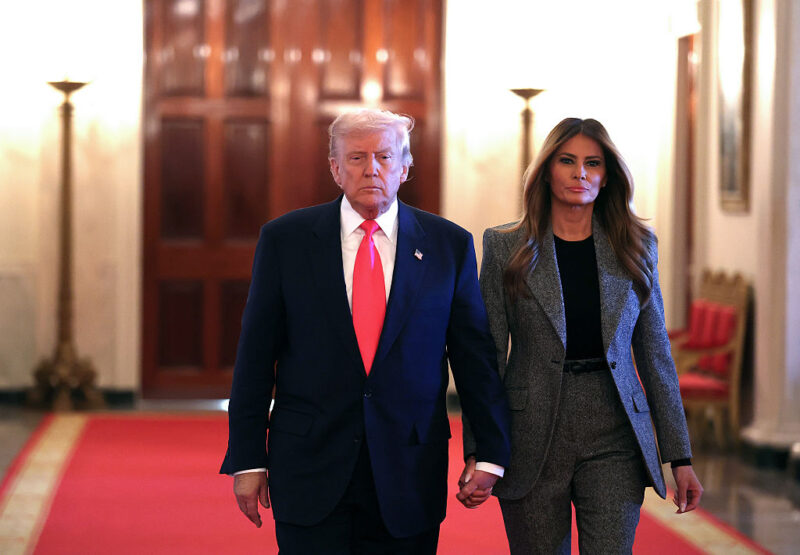 ‘She’s There for the Bacon Not the Pig’: Trump and Melania’s Sweet Holiday Pic Looked Innocent Until a Quick Photographer Caught the Split Second Her Real Feelings Slipped Out