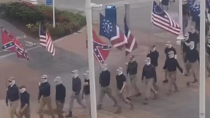‘Traded the Pointed Caps for Baseball Caps’: Masked White Supremacist Group Patriot Front Marches Through Virginia Beach Oceanfront, Sparking First Amendment Debate